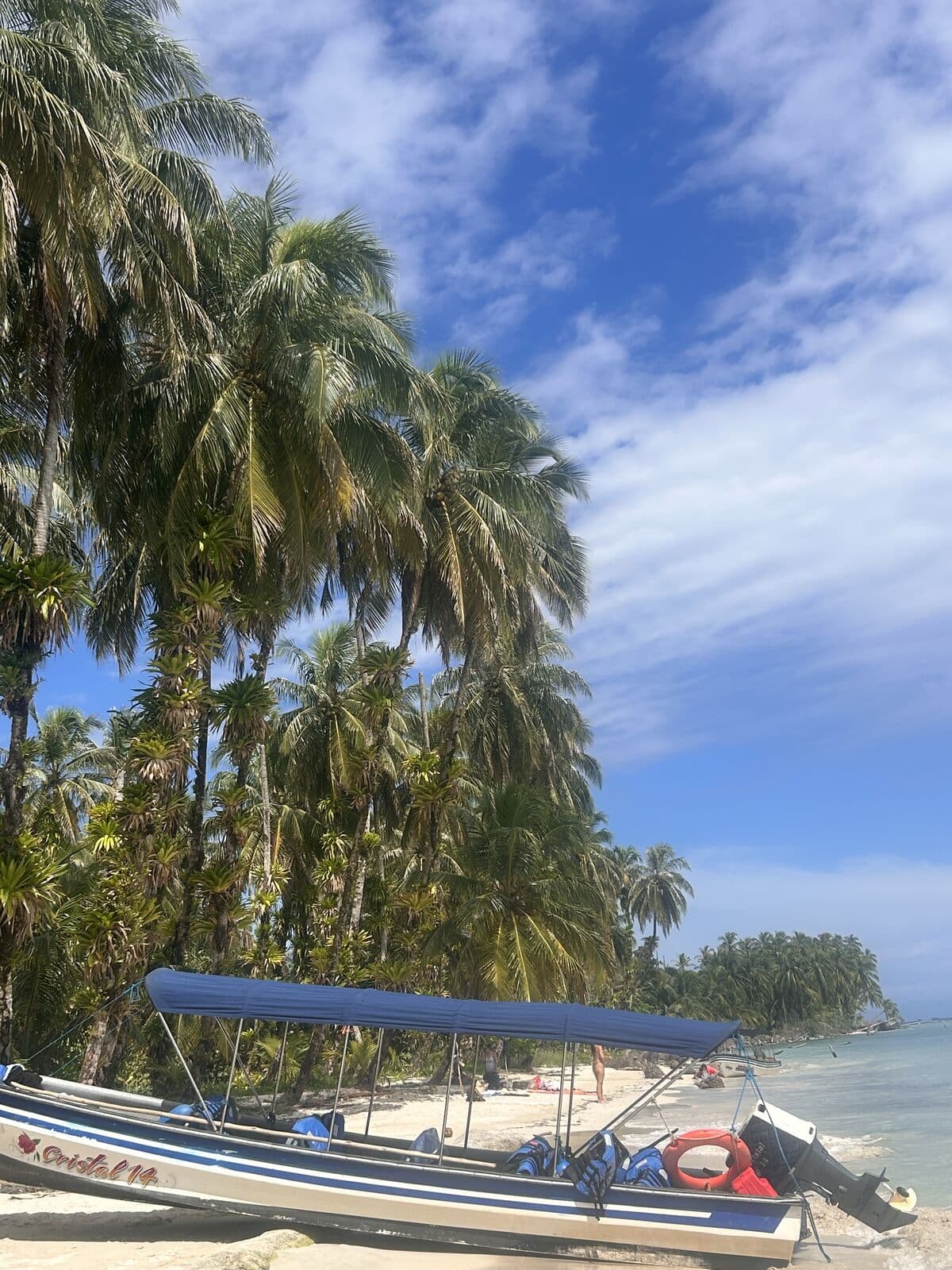 Boat arriving at the shore of the Zapatilla Cays
