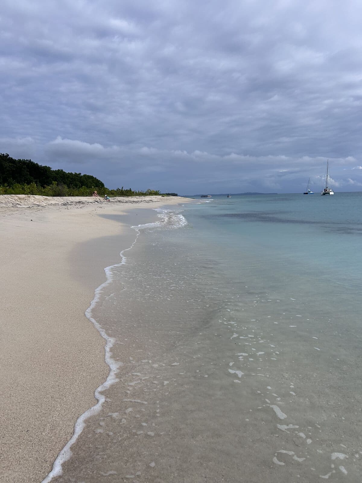 White-sand beach and clear water at the Zapatilla Cays